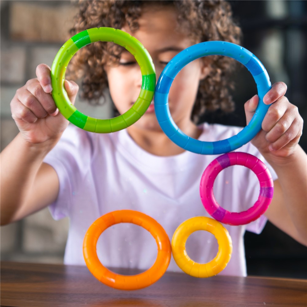 Child playing with Fat Brain Toys - TinkerRings