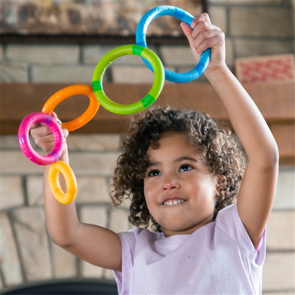 Child playing with Fat Brain Toys - TinkerRings