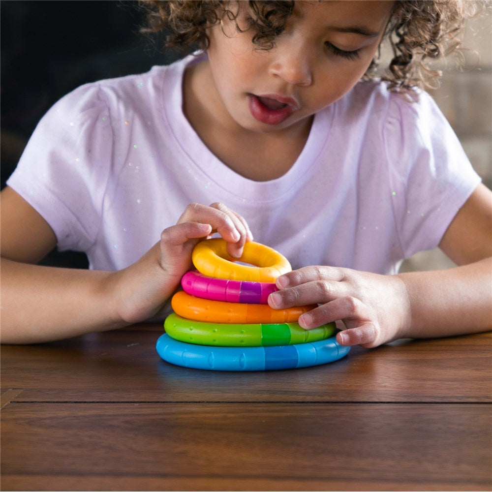 Child playing with Fat Brain Toys - TinkerRings