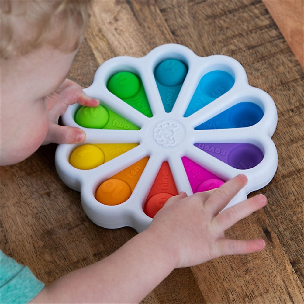 Child playing with Fat Brain Toys | Dimpl Digits