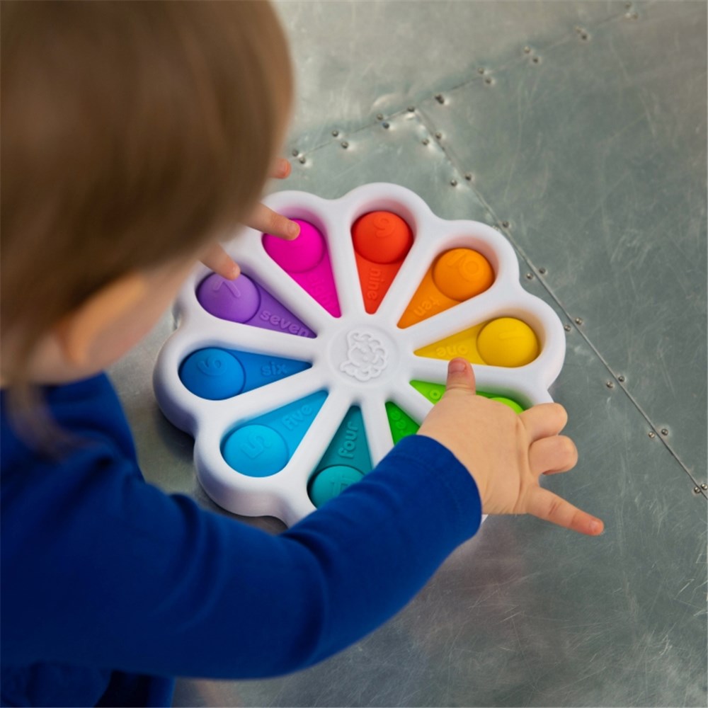 Child playing with colourful Fat Brain Toys | Dimpl Digits