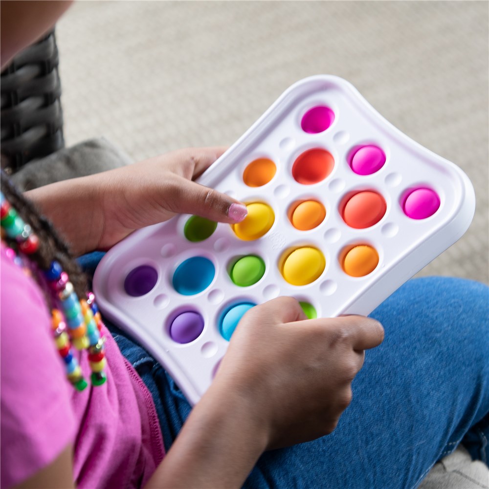 Person playing with a colorful bubble pop toy