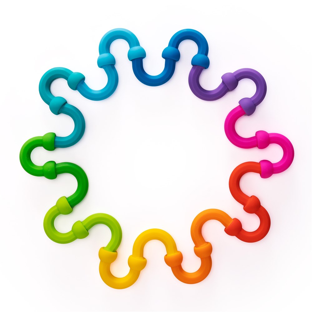 Colorful plastic links arranged in a circular pattern on a white background