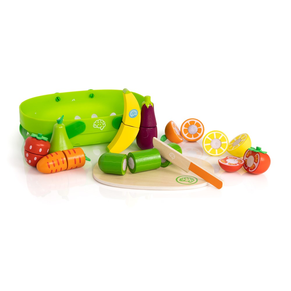 Colorful toy kitchen set with fruits, vegetables, and cutting board on a white background
