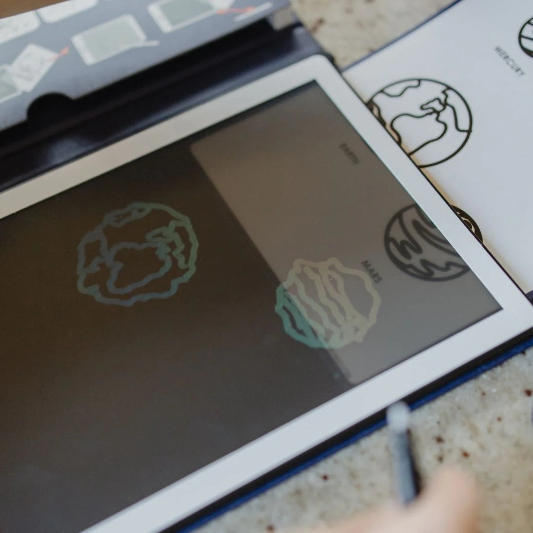 Digital tablet with tattoo designs on a textured surface