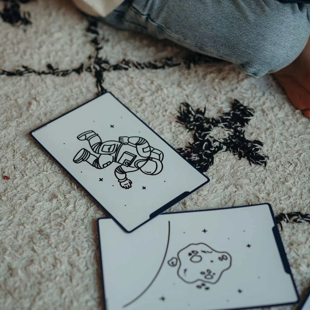 Two black and white illustrations of a robot and a cloud on a textured surface.