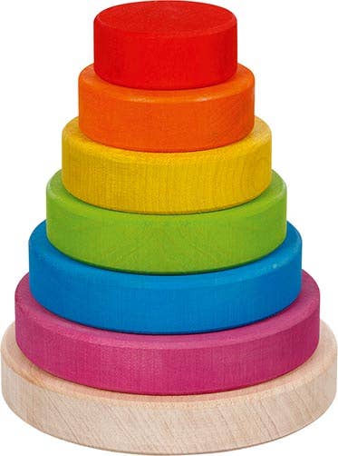 A colourful wooden stacking tower with red, orange, yellow, green, blue and purple rings on a natural wood base.