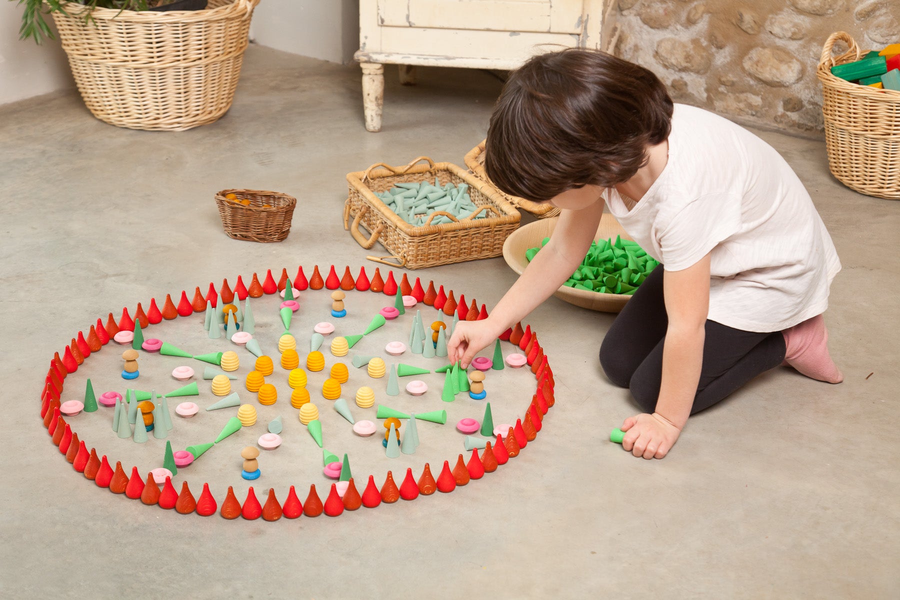 Child playing with colorful toys on the floor in a home setting