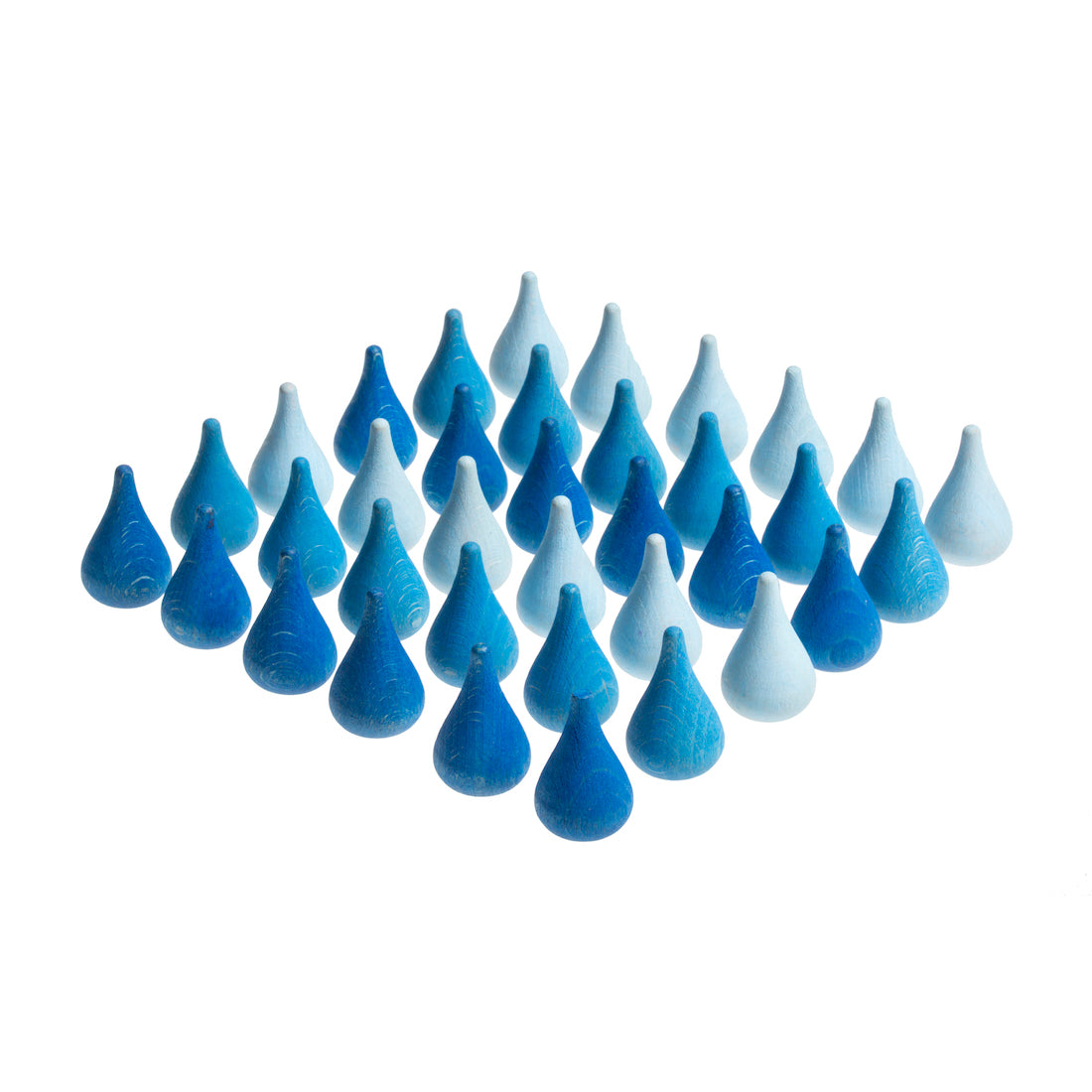 Set of blue and white ceramic teardrop-shaped objects on a white background