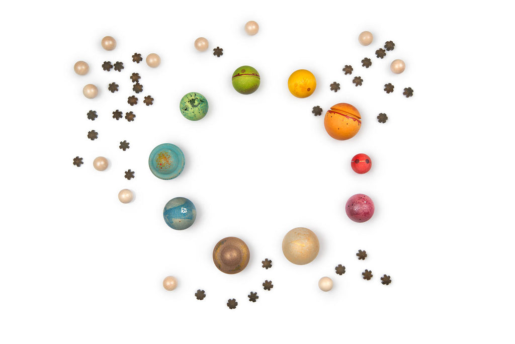 Colorful model of planets arranged in a circular pattern on a white background