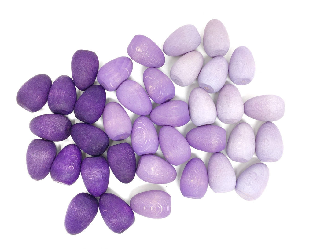 Purple and white stones on a white background