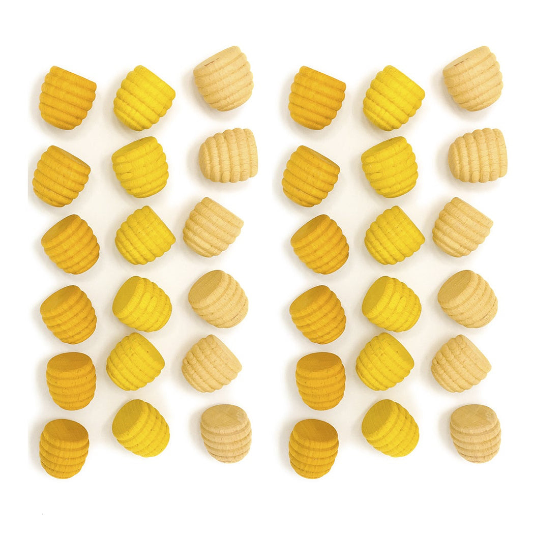 Yellow and beige shapes arranged in a pattern on a white background