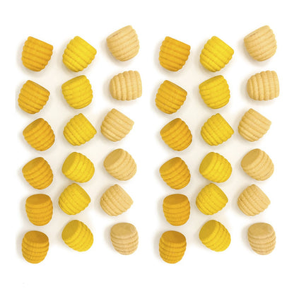 Yellow and beige shapes arranged in a pattern on a white background