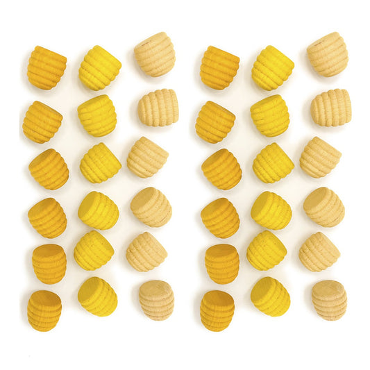 Yellow and beige shapes arranged in a pattern on a white background
