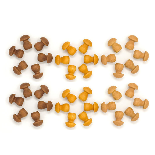 Set of wooden mushroom-shaped objects in brown and orange on a white background