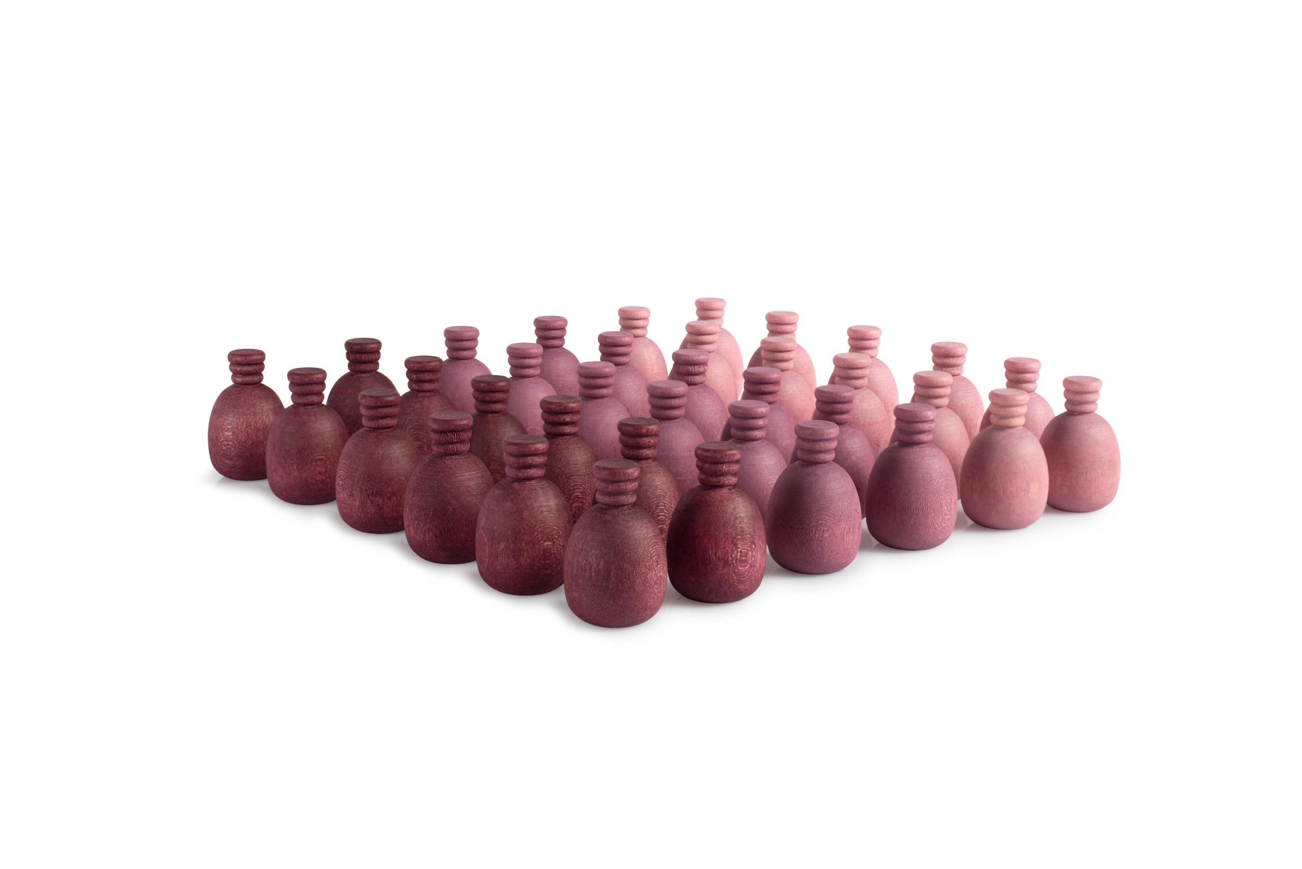 Row of small pink bottles on a white background