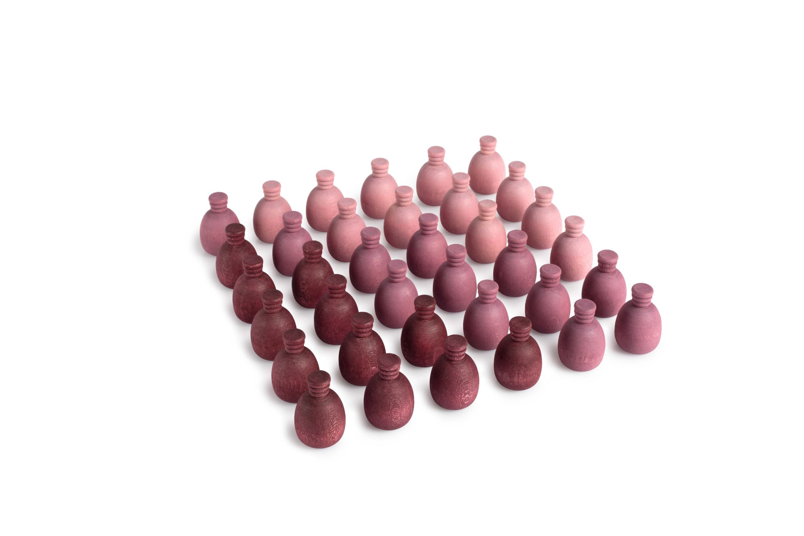 Set of pink and red wooden bottles arranged in a pattern on a white background