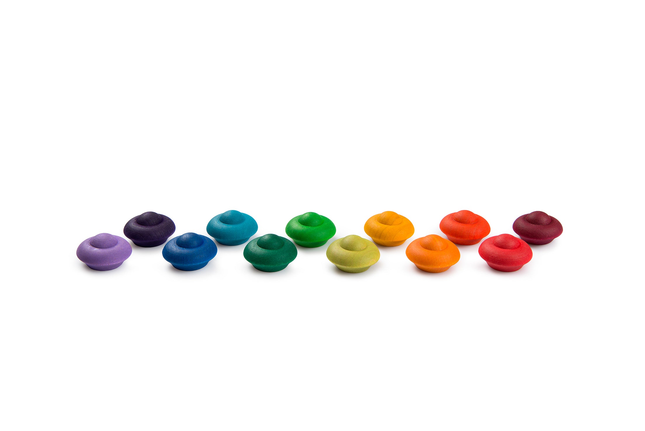 Row of colorful donut-shaped objects on a white background