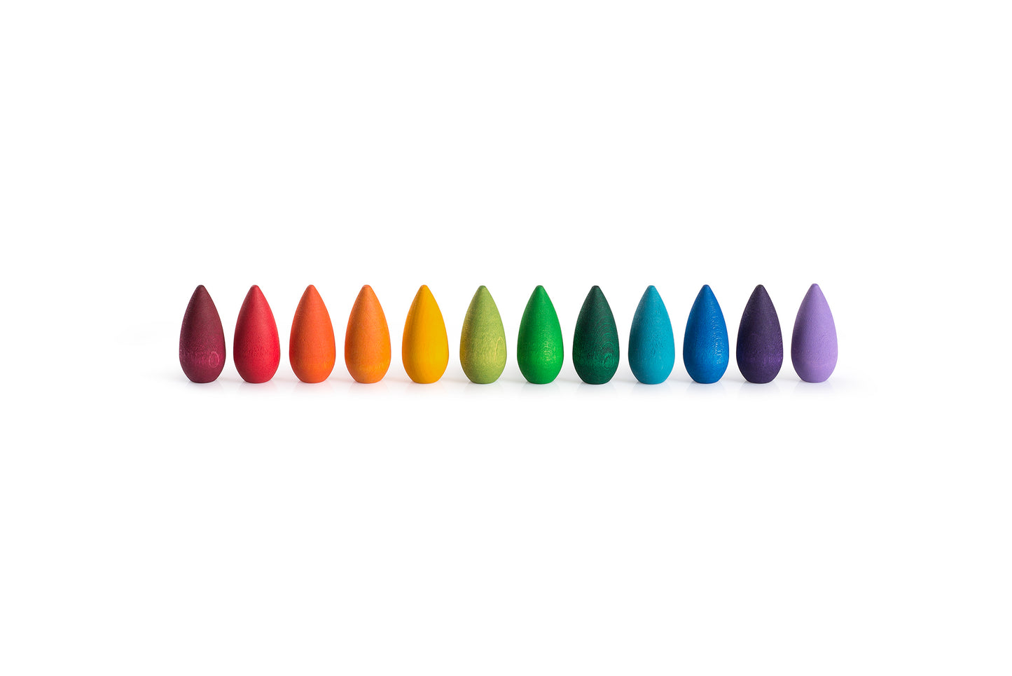 Row of colorful teardrop-shaped objects on a white background