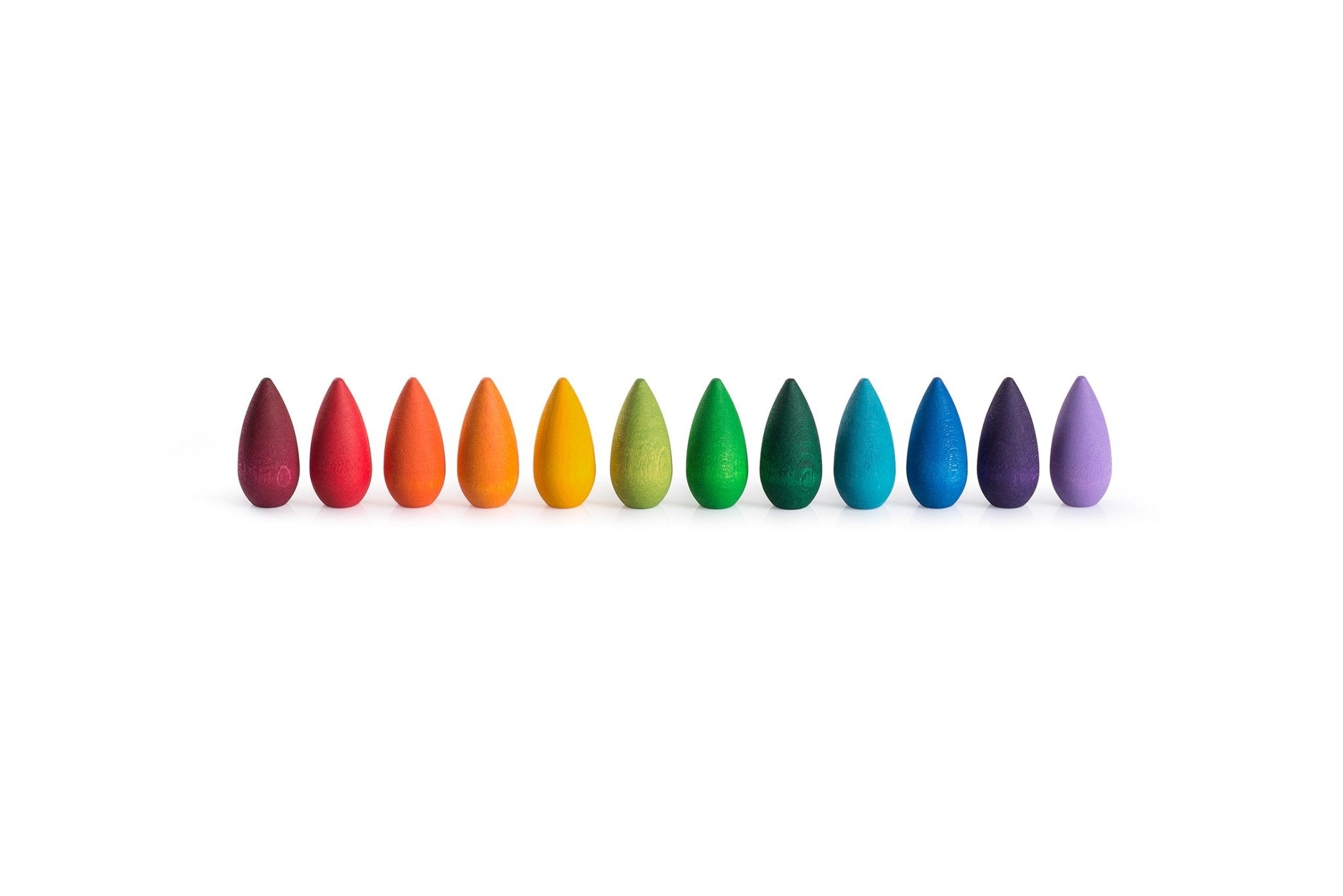 Row of colorful teardrop-shaped objects on a white background