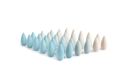Set of blue and white wooden teardrop-shaped objects on a white background