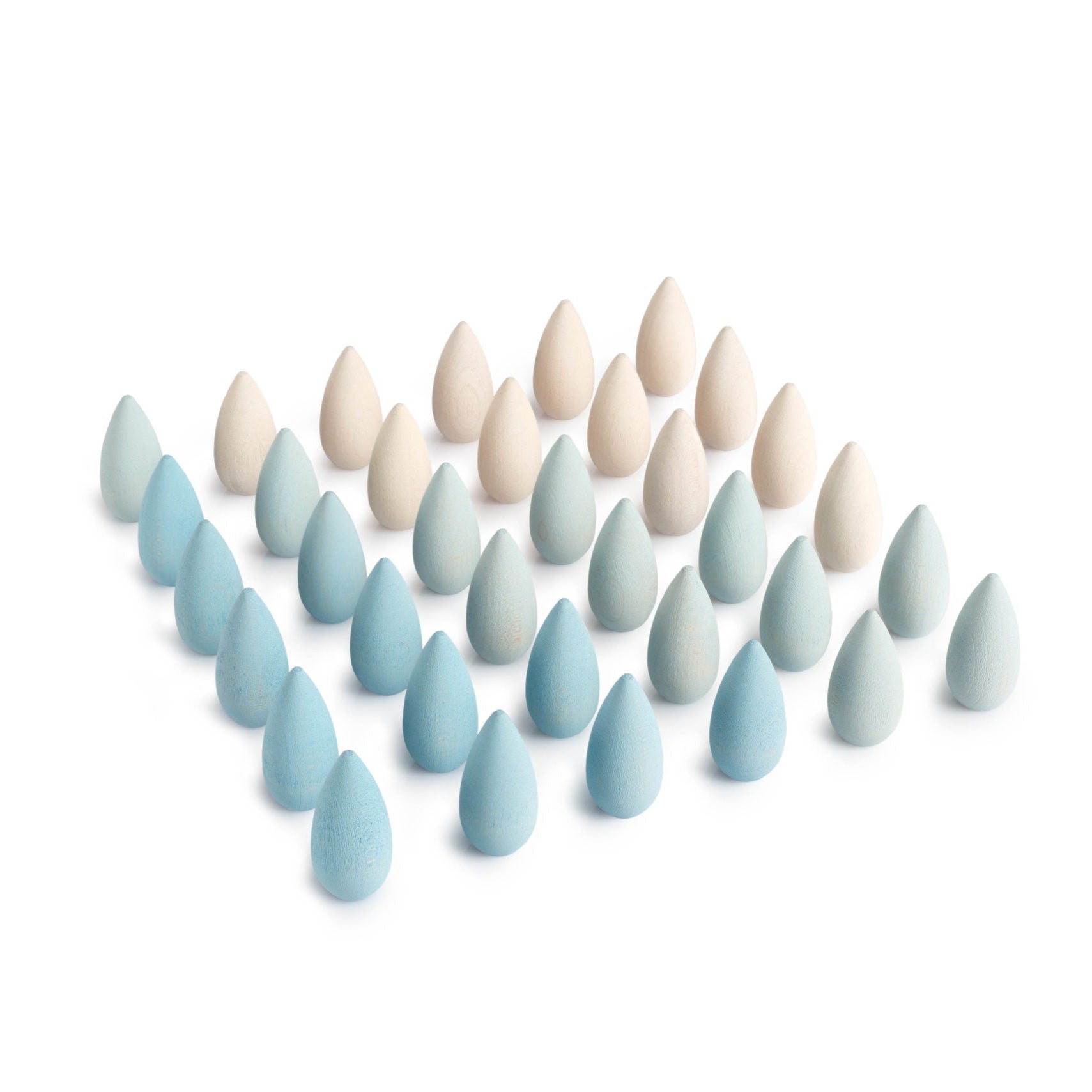 Set of teardrop-shaped ceramic eggs in various shades of blue and beige on a white background