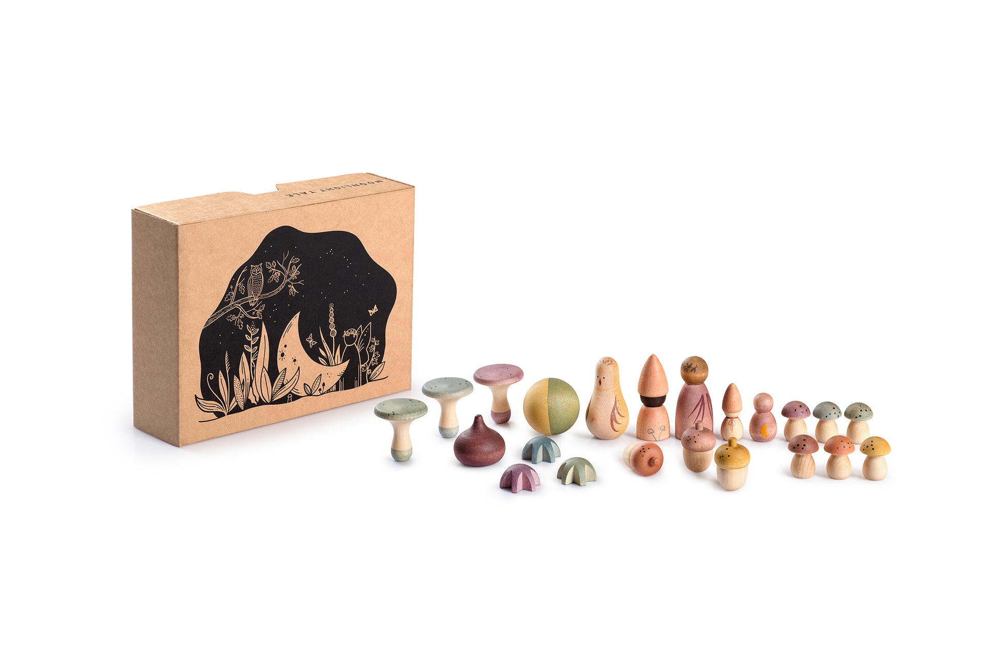 Set of wooden figurines in front of a cardboard box with a night design on a white background