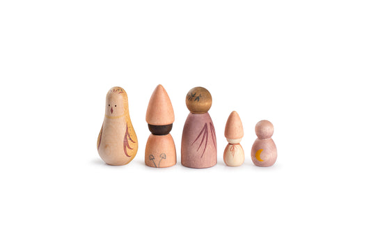 Set of five wooden dolls with different hairstyles on a white background