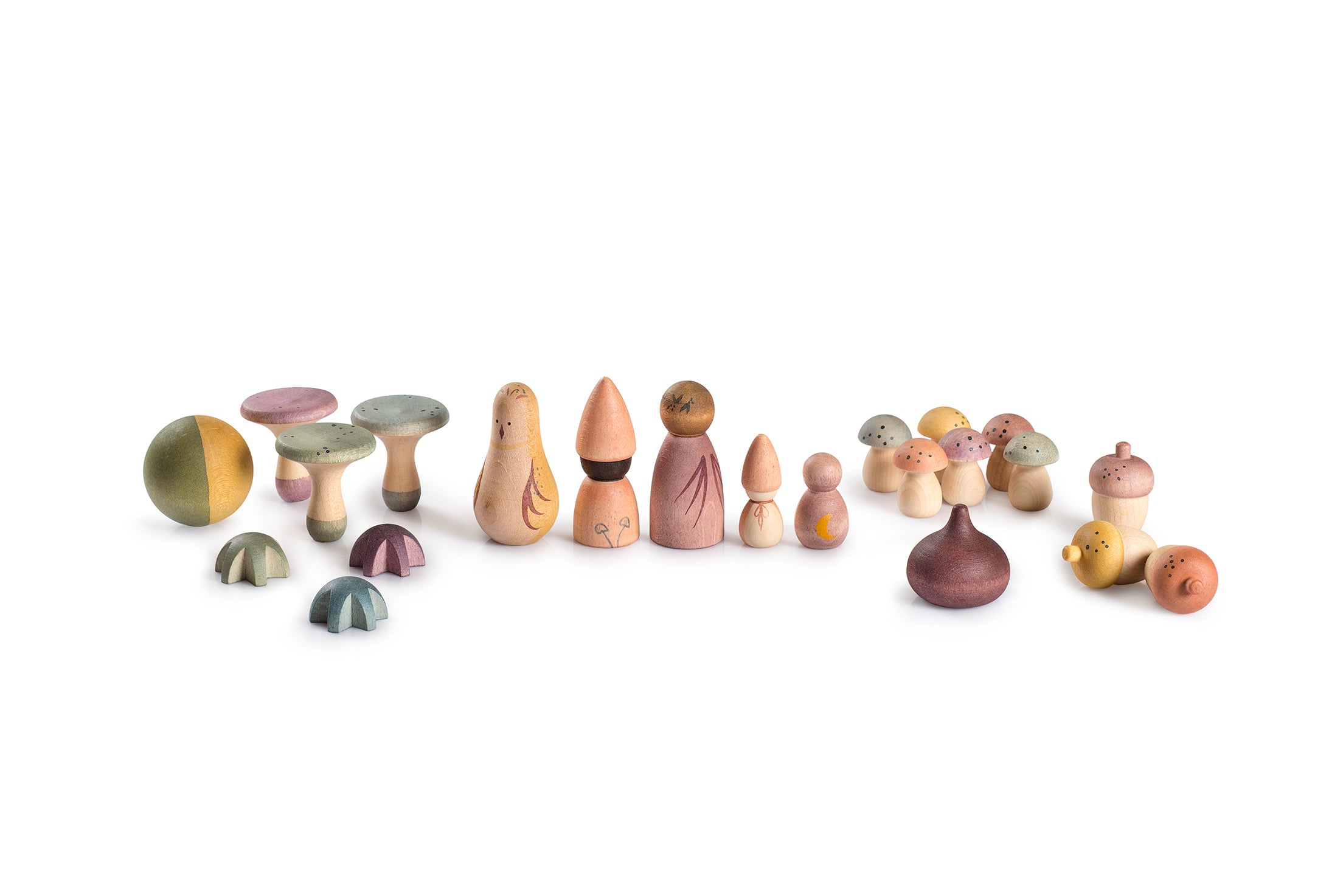 Set of colorful wooden mushroom-shaped figurines on a white background