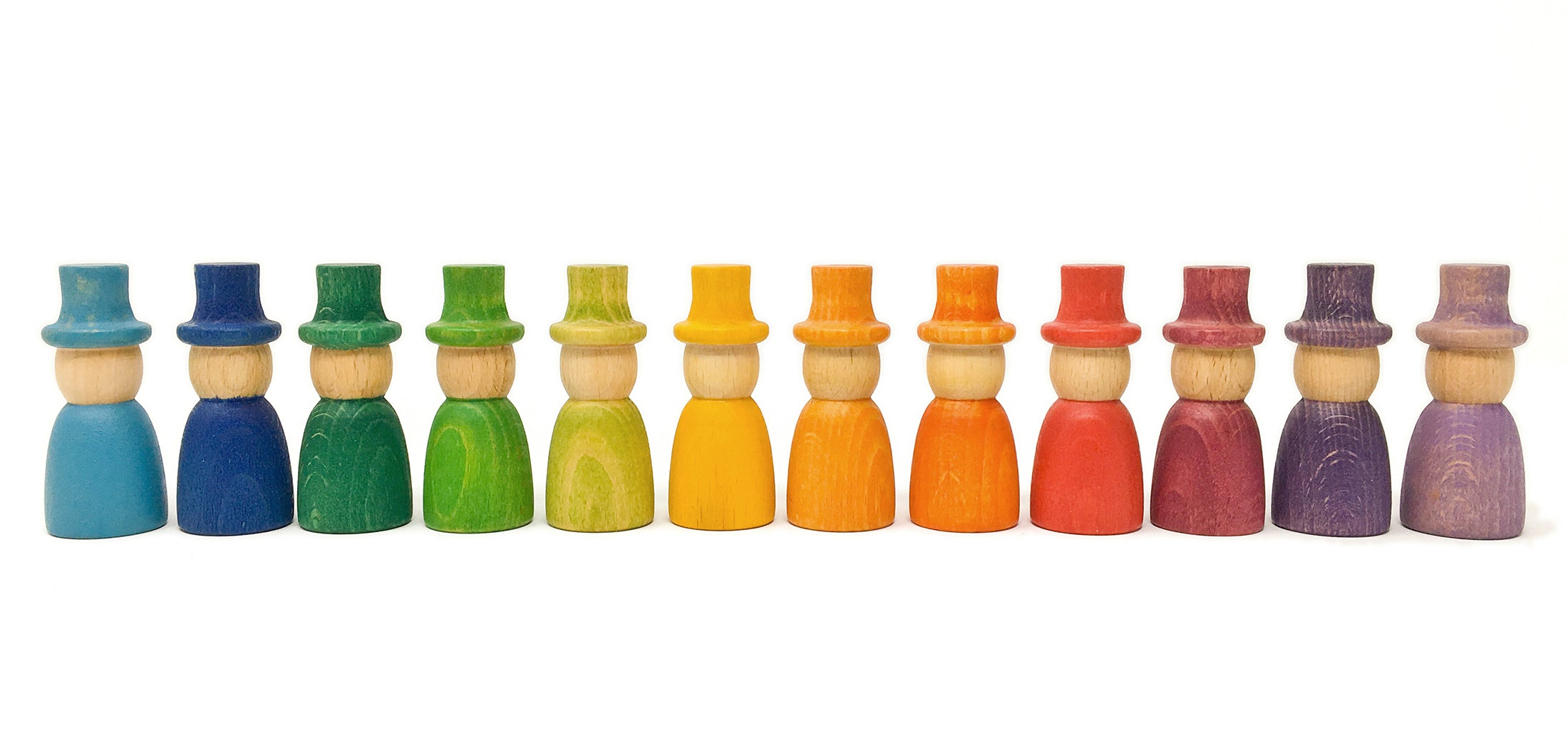 Set of colorful wooden peg dolls in a row on a white background