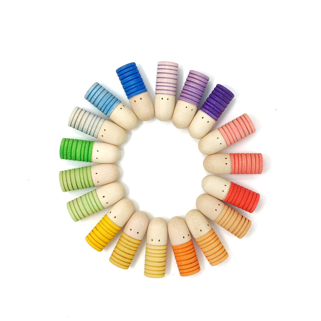 Colorful wooden pegs arranged in a circular pattern on a white background