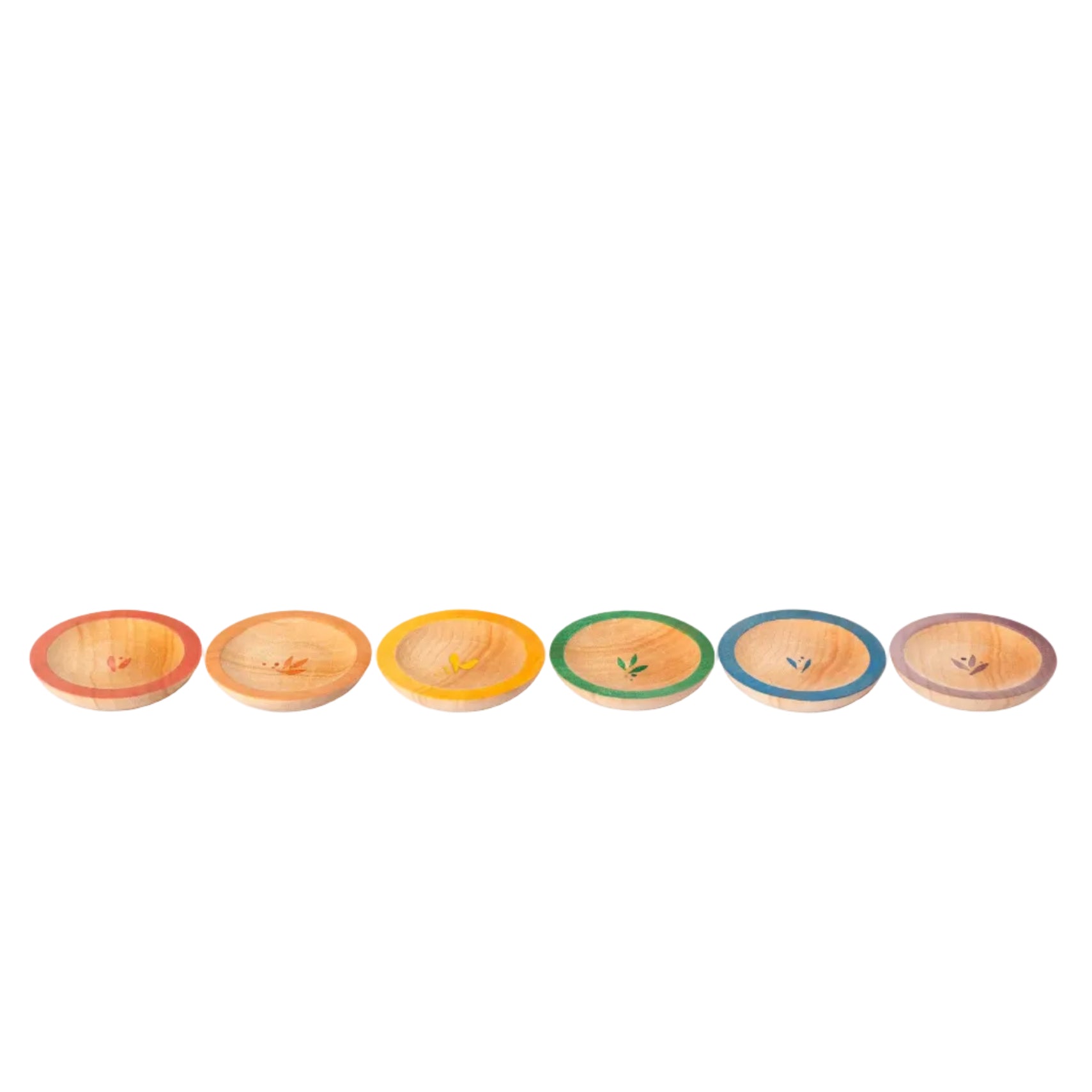 Set of colorful ceramic plates arranged in a row on a white background