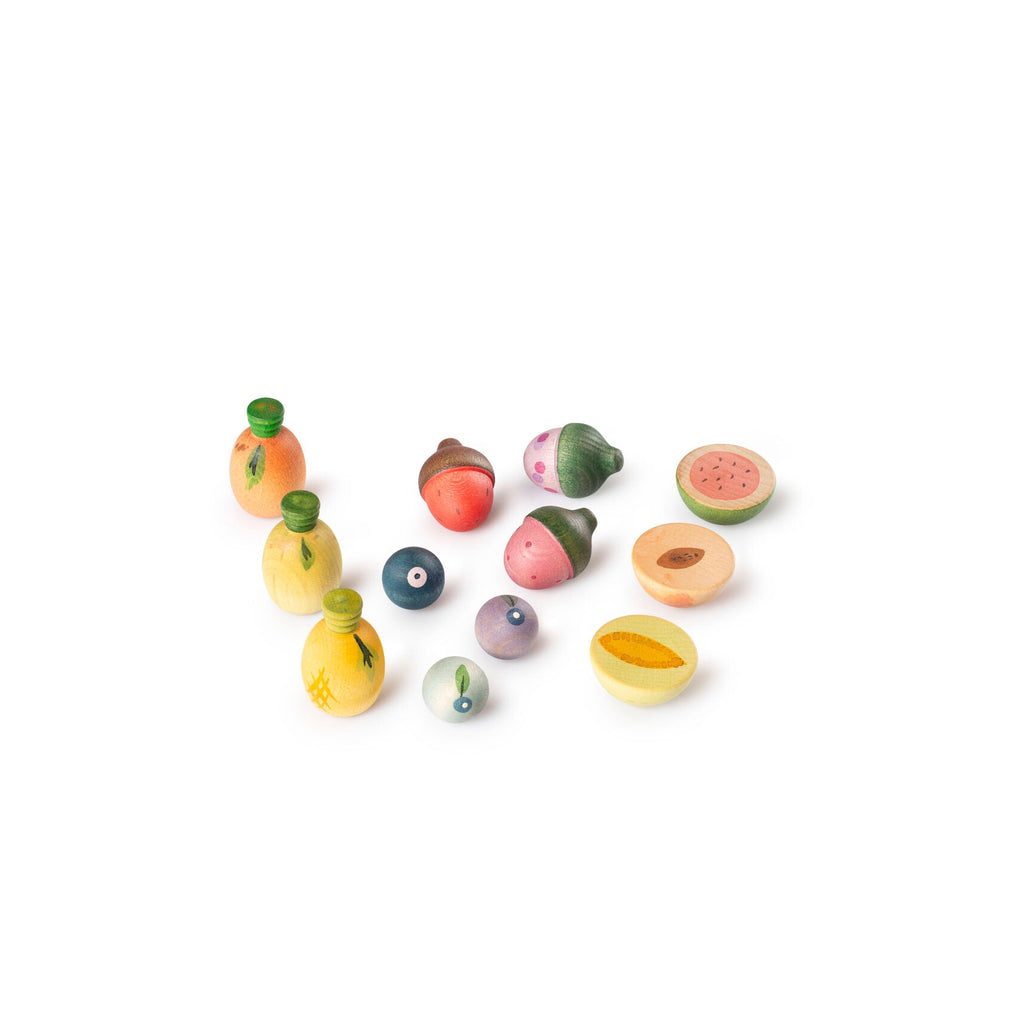 Set of small fruit-shaped toys on a white background