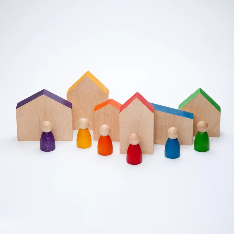 Colorful wooden houses with corresponding figures on a white background