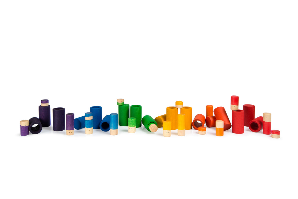 Colorful cylindrical objects arranged in a scattered pattern on a white background