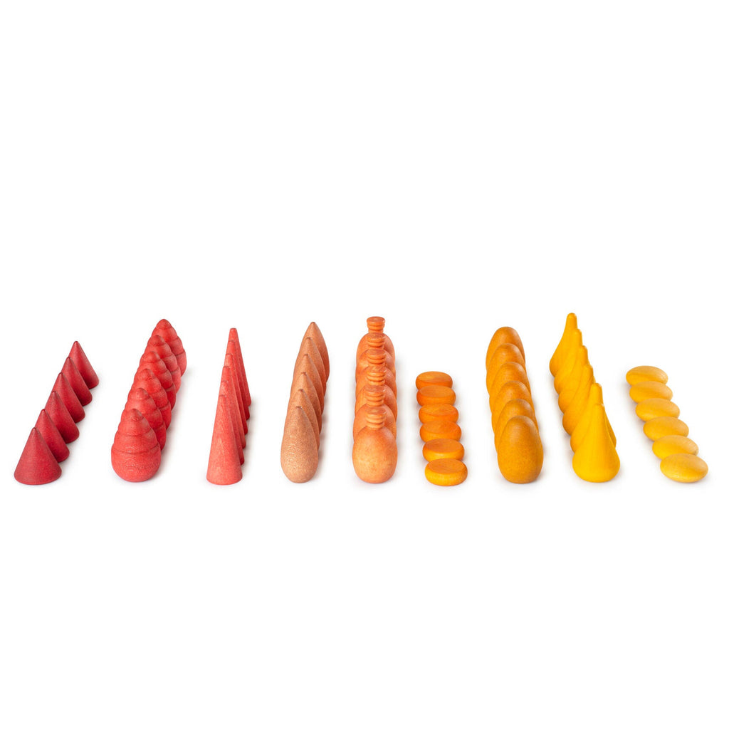 Set of colorful, cone-shaped candles on a white background