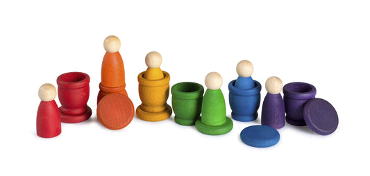 Colorful wooden peg dolls and pots on a white background