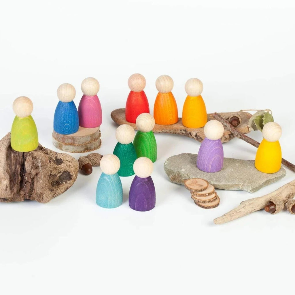 Colorful wooden peg people on a white background