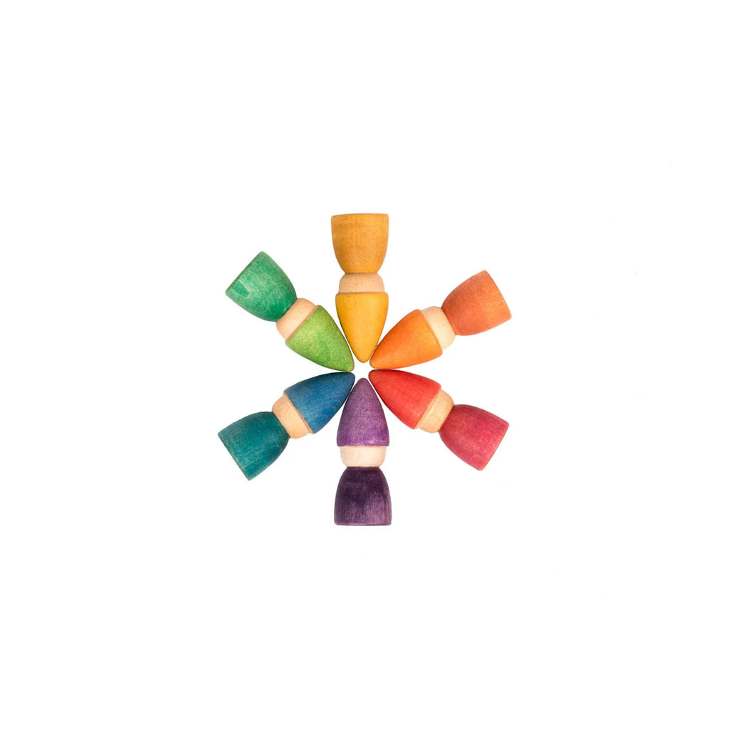 Colorful wooden toys arranged in a circular pattern on a white background