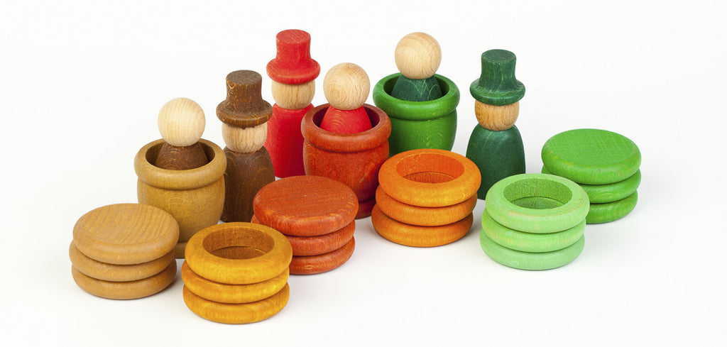 Colorful wooden toy rings on a white background