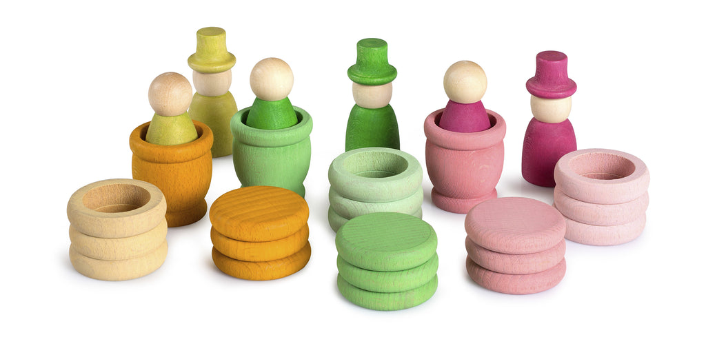 Set of colorful wooden toys including stacks and figures on a white background