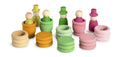 Set of colorful wooden toys including stacks and figures on a white background