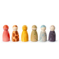 Set of colorful wooden peg dolls on a white background