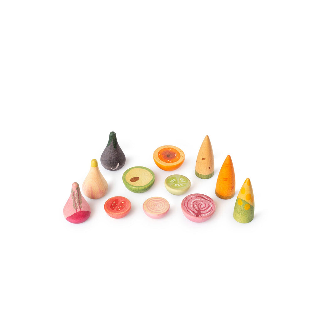 Set of colorful toy fruits and vegetables on a white background
