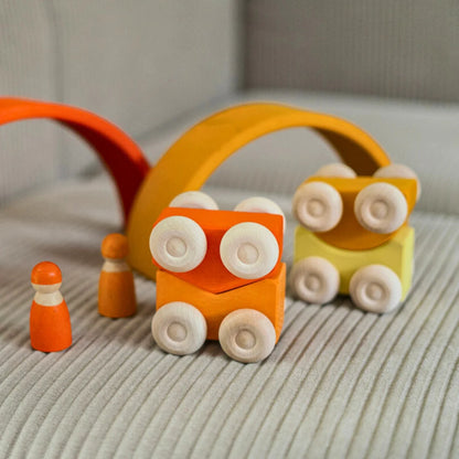 Set of colorful wooden toys on a textured surface