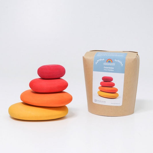 Colorful stacking toys and their packaging on a white background