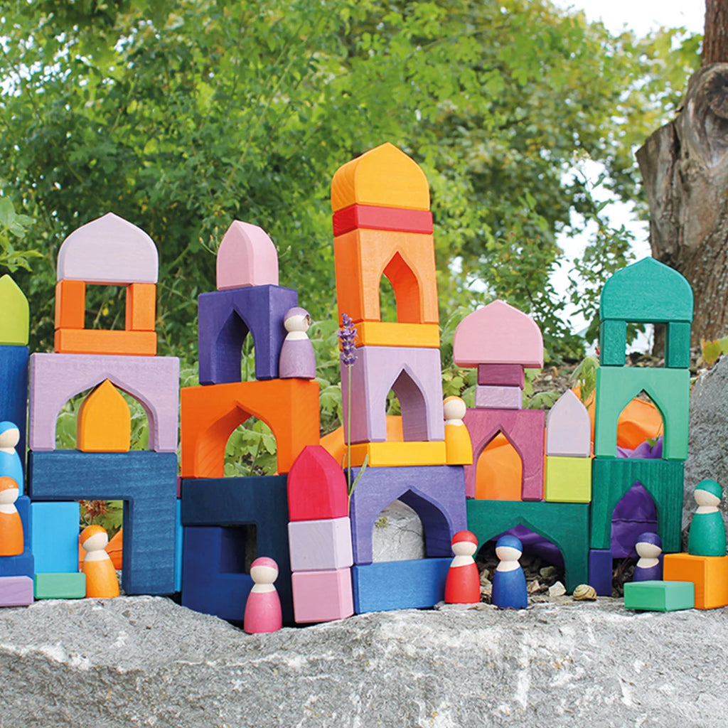 Colorful toy castle built with interlocking blocks on a natural background
