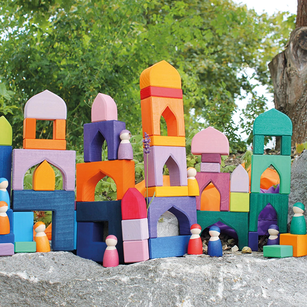 Colorful toy castle built with interlocking blocks on a natural background