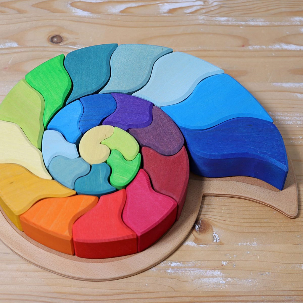 Colorful wooden puzzle on a wooden surface