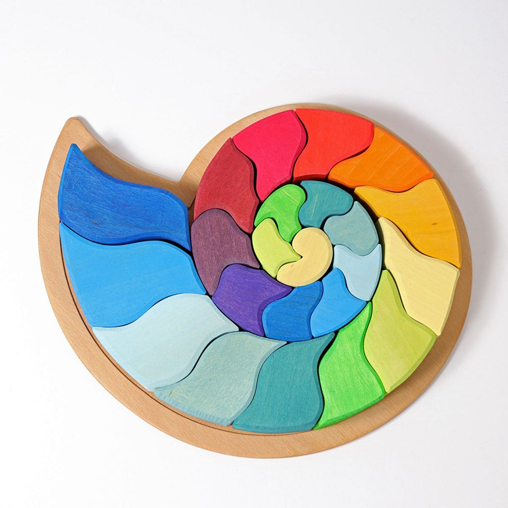 Colorful wooden puzzle with a spiral design on a white background